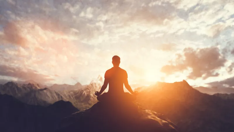 Man in yoga pose zen meditation at sunset 2022 10 24 21 57 48 utc